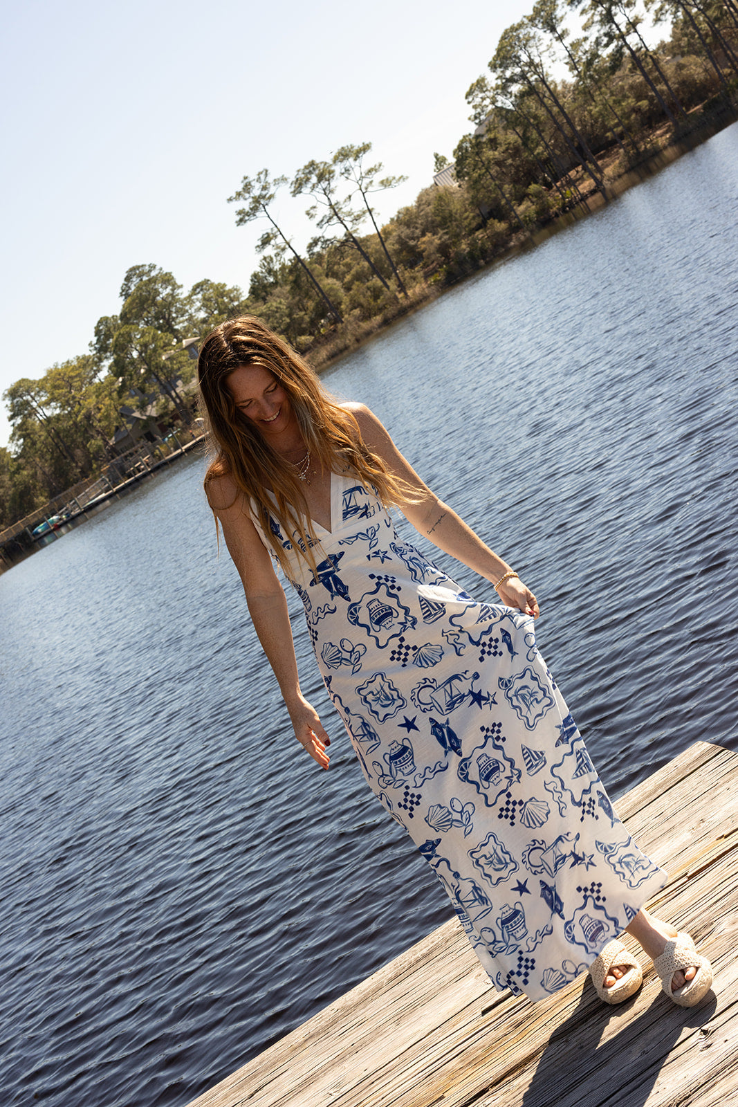 Model in the Santorini Maxi Dress by the water
